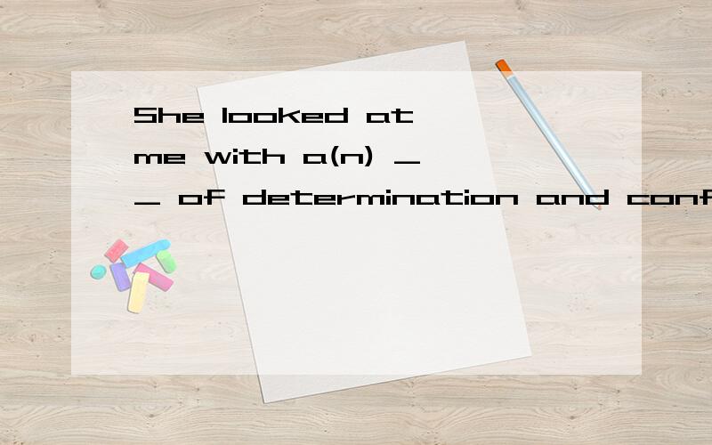 She looked at me with a(n) __ of determination and confidence.A.dignity B.ring C.air D.