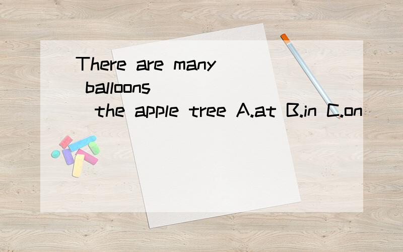 There are many balloons______the apple tree A.at B.in C.on